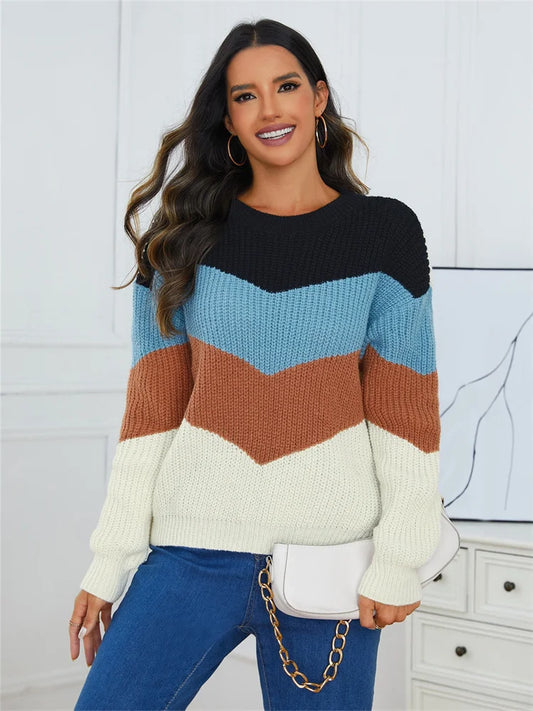 Color spliced women's sweater featuring a trendy chevron design in black, blue, rust, and cream colors, perfect for casual wear.